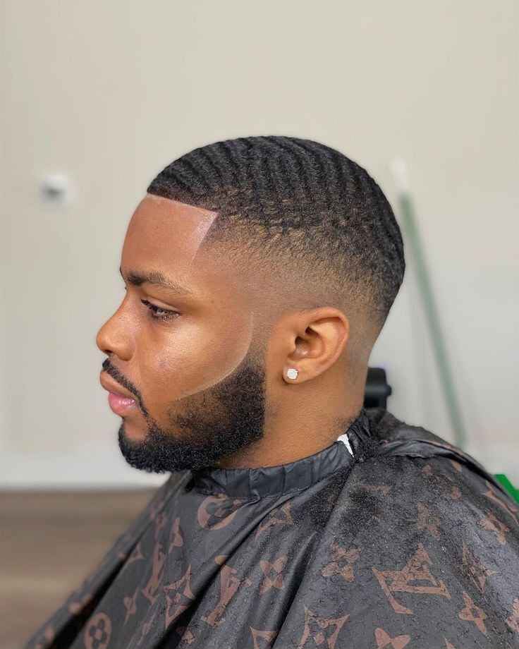 Barber shaping a beard